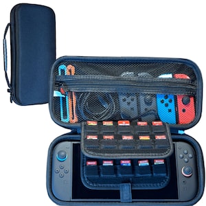 May include: A navy blue carrying case for a gaming console, open to reveal the console, controllers, and game cartridges. The case has a handle and a zippered mesh compartment. The console has blue and red controllers attached.