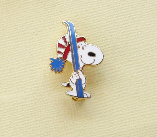 Aviva Vintage Snoopy Holding Blue Skis With Red and White Striped