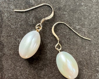 Large white freshwater pearls dangle earrings