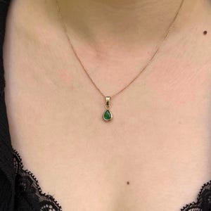 Dainty pear shaped emerald gold pendant. 14k gold pendant with zambian emerald bezel set cabochon