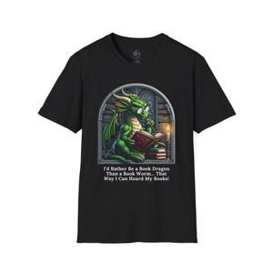 May include: Black t-shirt with a green dragon wearing glasses and reading a book. The dragon is in a library setting with bookshelves and a candle. The text on the shirt reads: "I'd Rather Be a Book Dragon Than a Book Worm... That Way I Can Hoard My Books!"