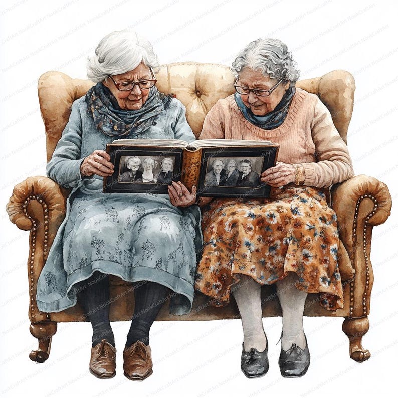May include: Two women sit on a brown leather couch, looking at a photo album together. The album is open to a page with black and white photos of people. The women are wearing casual clothing and have gray hair.