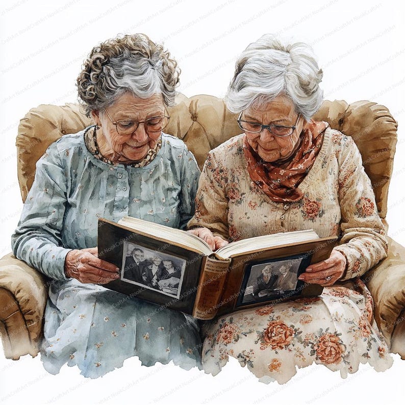 May include: Two older women sit in a brown armchair, looking at a photo album together. The album is open to a page with two black and white photos. The women are wearing floral dresses and sweaters.