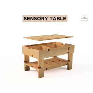 May include: A light-colored wooden sensory table with a removable lid. The table has two compartments and a lower shelf. The text "SENSORY TABLE" is displayed above the table.