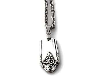 May include: A silver necklace with a pendant made from a vintage silverware piece. The pendant features a floral design.