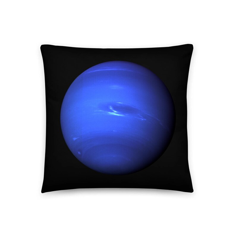 May include: A square throw pillow featuring a deep black background with a large, centered, spherical image of the planet Neptune. The planet is depicted in vibrant shades of blue with subtle, lighter cloud-like atmospheric bands visible.