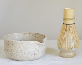 Speckled white matcha bowl with spout for healthy drinks, ceramic whisk holder for slow mornings, bamboo matcha tools for minimalist rituals