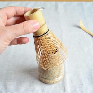 Matcha whisk holder with bamboo whisk handmade chasen stand speckled cream ceramic matcha accessories ceremony gift earthy rustic pottery