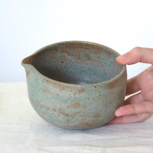Detail of teal blue glaze on large ceramic bowl with spout. The wheel-thrown texture and generous depth highlight the artisanal quality, perfect for matcha fans who love both beauty and functionality.