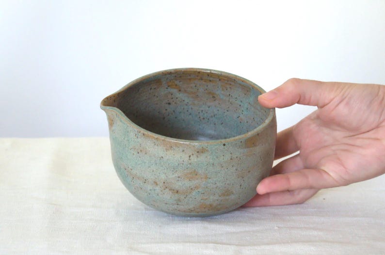 Detail of teal blue glaze on large ceramic bowl with spout. The wheel-thrown texture and generous depth highlight the artisanal quality, perfect for matcha fans who love both beauty and functionality.