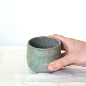 Rustic ceramic tea set including bowl, bamboo tools and whisk holder. Styled in natural light, it reflects a calm and grounded matcha moment for mindful homes and slow morning routines.