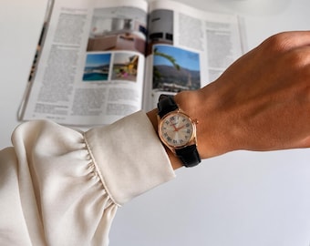 Vintage Round Watch: Gold Case, Black Leather Band, Roman Numerals