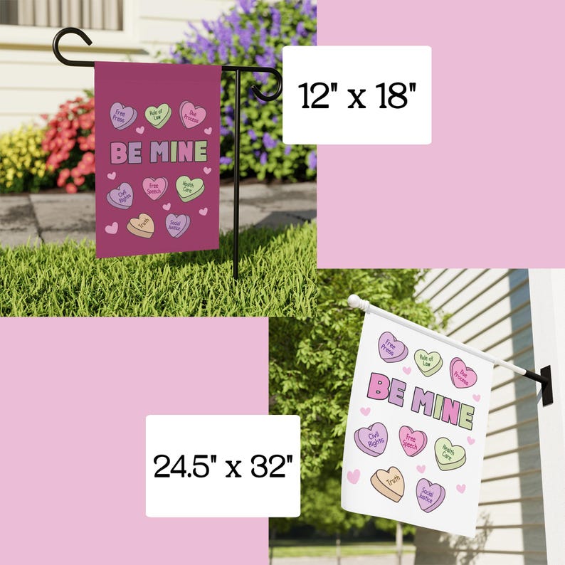 May include: A set of two garden flags, one measuring 12" x 18" and the other 24.5" x 32". Both flags are magenta with the words "BE MINE" and heart-shaped candies with phrases like "Free Press" and "Civil Rights".