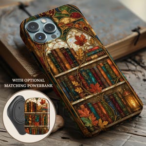 May include: A smartphone case featuring a stained glass design of bookshelves filled with colorful books, autumn leaves, and a lantern. The text "WITH OPTIONAL MATCHING POWERBANK" is visible. A circular inset shows the matching powerbank design.