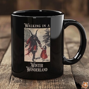 May include: Black ceramic mug featuring a vintage illustration of a horned figure and a child walking in a snowy landscape. The text "Walking in a Winter Wonderland" is displayed in elegant script.