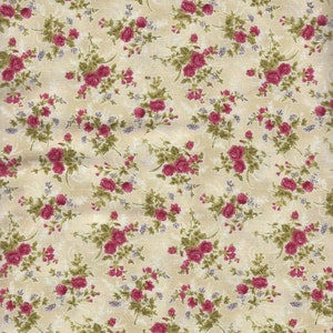 May include: A beige fabric with a repeating pattern of pink roses and green leaves.