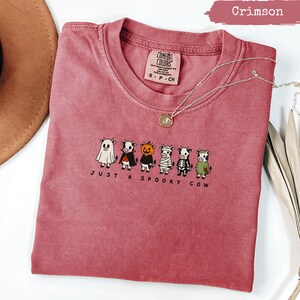 Crimson Comfort Colors t-shirt with "Just a Spooky Cow" text and cartoon cows.