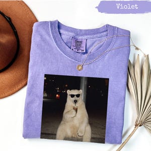 Lavender Comfort Colors t-shirt with polar bear holding iced coffee graphic.