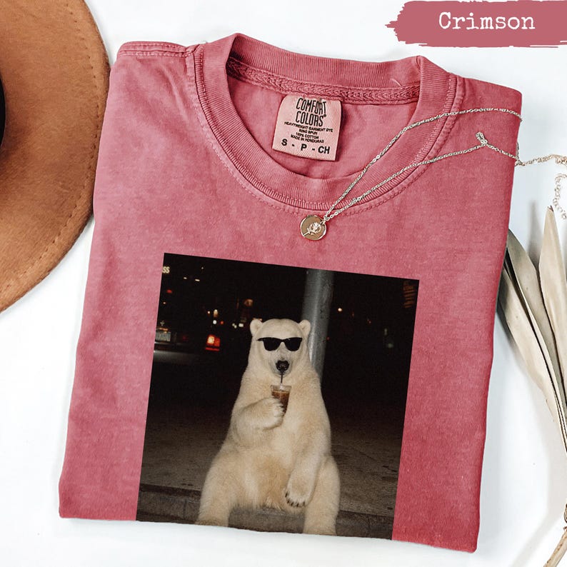 Crimson Comfort Colors t-shirt with polar bear wearing sunglasses holding coffee.