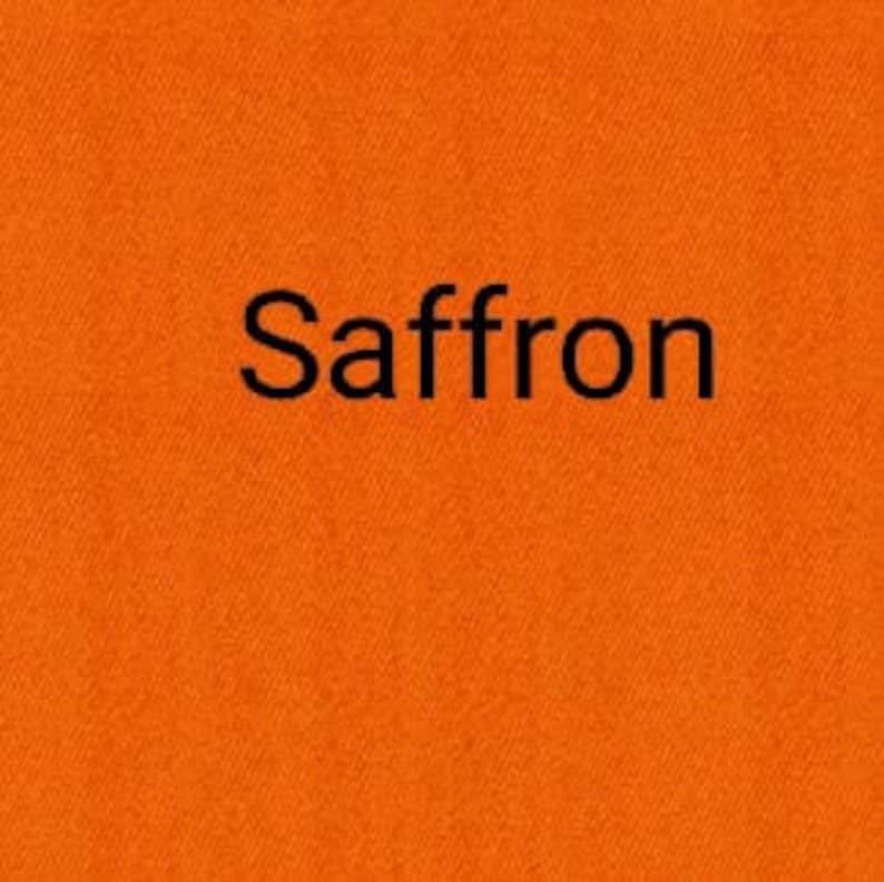 May include: A solid orange fabric swatch with the word "Saffron" printed in black.