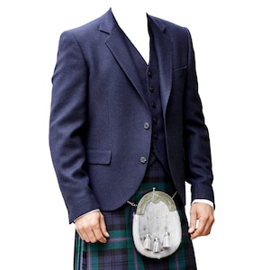 May include: A navy blue three-piece suit with a matching jacket, vest, and trousers. The suit is paired with a traditional Scottish kilt in a green and blue plaid pattern. A white sporran with silver accents hangs from the waist.