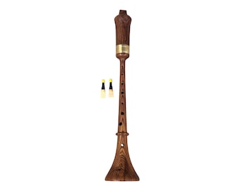 May include: A wooden recorder with a brown and black wood grain finish. The recorder has a brass band around the top and a flared bell at the bottom. Two small yellow and black cleaning brushes are included.