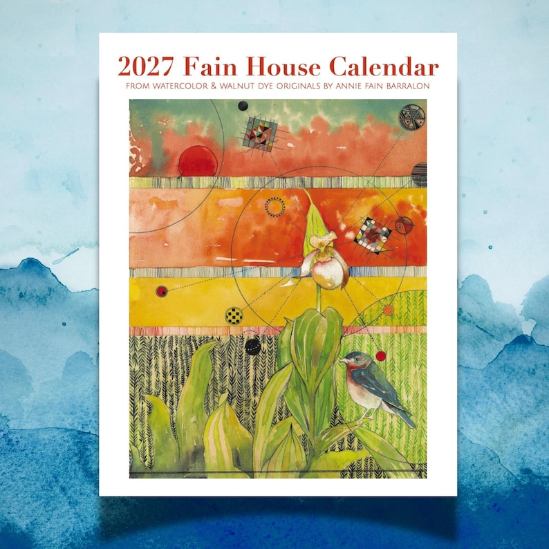 May include: The 2027 Fain House Calendar features watercolor and walnut dye artwork by Annie Fain Barralon. The cover displays a vibrant landscape with a central orchid, a small bird, geometric patterns, and circular motifs in orange, yellow, and green.