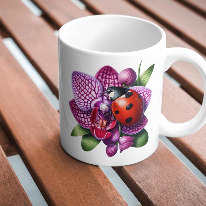 May include: White ceramic mug with a colorful illustration of a ladybug on a pink and purple orchid flower.