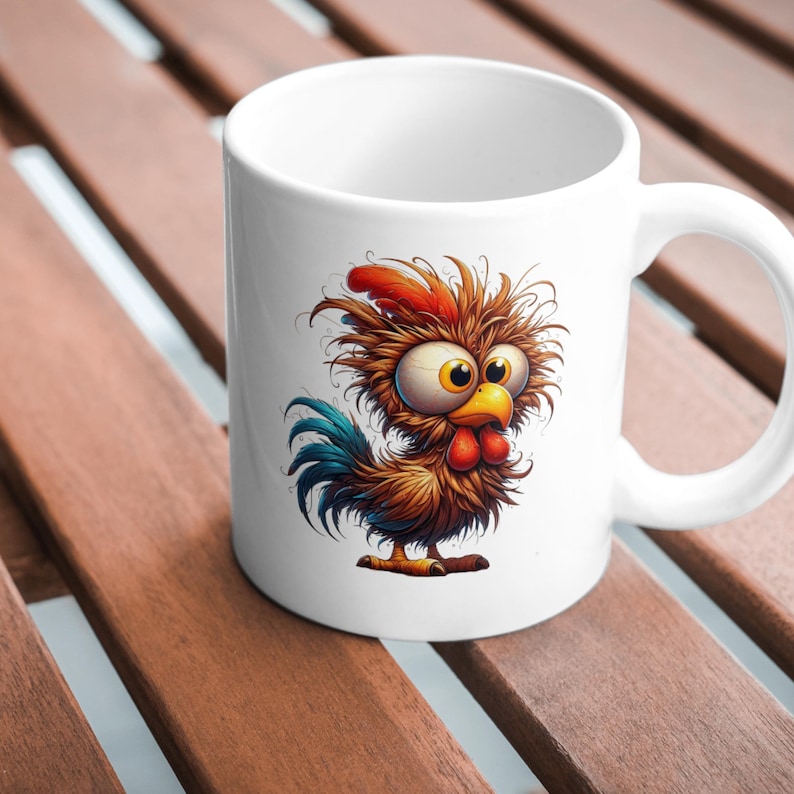 May include: White ceramic mug with a cartoon illustration of a brown and orange rooster with blue feathers and large eyes. The rooster has a red comb and wattle.