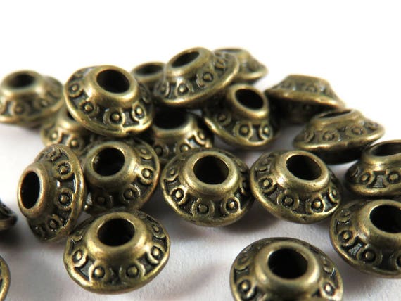 25 petits métal perles 5*3mm Bicone Antique Argent