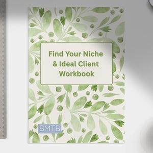 May include: A workbook titled "Find Your Niche & Ideal Client Workbook" with a watercolor floral design in shades of green. A metal ruler, a pen, and a cup of coffee are also visible.