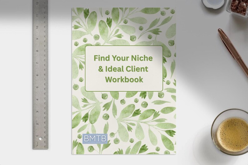 May include: A workbook titled "Find Your Niche & Ideal Client Workbook" with a watercolor floral design in shades of green. A metal ruler, a pen, and a cup of coffee are also visible.