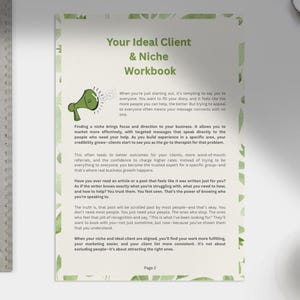 May include: A workbook titled "Your Ideal Client & Niche Workbook" with green watercolor accents. A metal ruler is on the left. A cup of coffee, a pen, and other items are on a white surface.