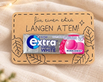 May include: A single pack of Wrigley's Extra Professional White Bubblemint chewing gum attached to a rectangular tan card. The card features black ink drawings of leaves and the German text: "für einen extra LANGEN ATEM!" with a small star icon.