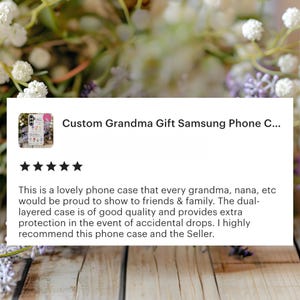 May include: A Samsung phone case with a floral design and the text "Custom Grandma Gift." The case is dual-layered for extra protection. The background features flowers and a wooden surface.