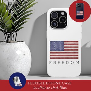 May include: White iPhone case featuring the American flag design with the word "FREEDOM" in a minimalist font. The case has a flexible design and is available in white or dark blue. A small circular image shows the case in dark blue.