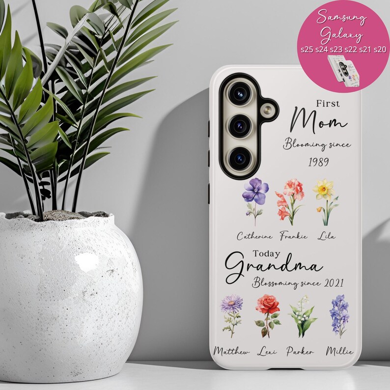 May include: A white phone case with a floral design and the words "First Mom Blooming since 1989" and "Today Grandma Blossoming since 2021". The case also features the names of family members.