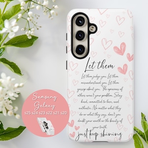 May include: White phone case featuring a pink heart design and the words "Let them just keep shining." Compatible with Samsung Galaxy S25, S24, S23, S22, S21, and S20 phones.