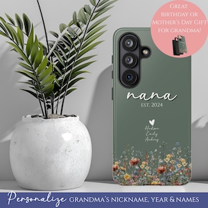 May include: A green phone case with the word "nana" in white script, the year "EST. 2024", and names below a heart graphic. The case features a floral design at the bottom and text that reads "Personalize GRANDMA'S NICKNAME, YEAR & NAMES".