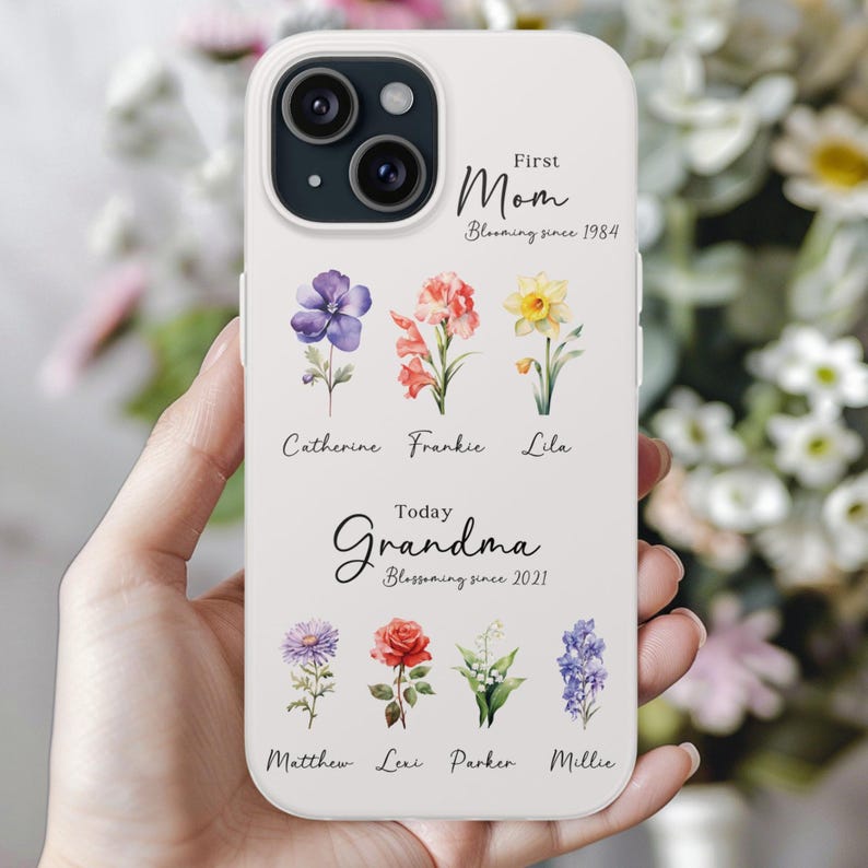 May include: White iPhone case with a floral design and the text "First Mom Blooming since 1984" and "Today Grandma Blossoming since 2021".