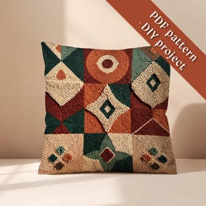 May include: A square punch needle cushion cover featuring a geometric patchwork design in shades of dark green, burnt orange, and cream. The textured surface displays various shapes including circles, diamonds, and squares. Text reads: PDF pattern - DIY project.