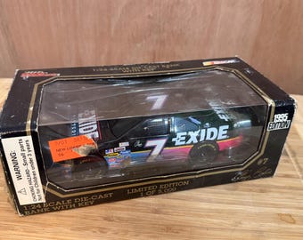 1994 Exide NASCAR Bank [IN-BOX] (Geoff Bodine #7) | 1:24 Racing Champions Diecast Car