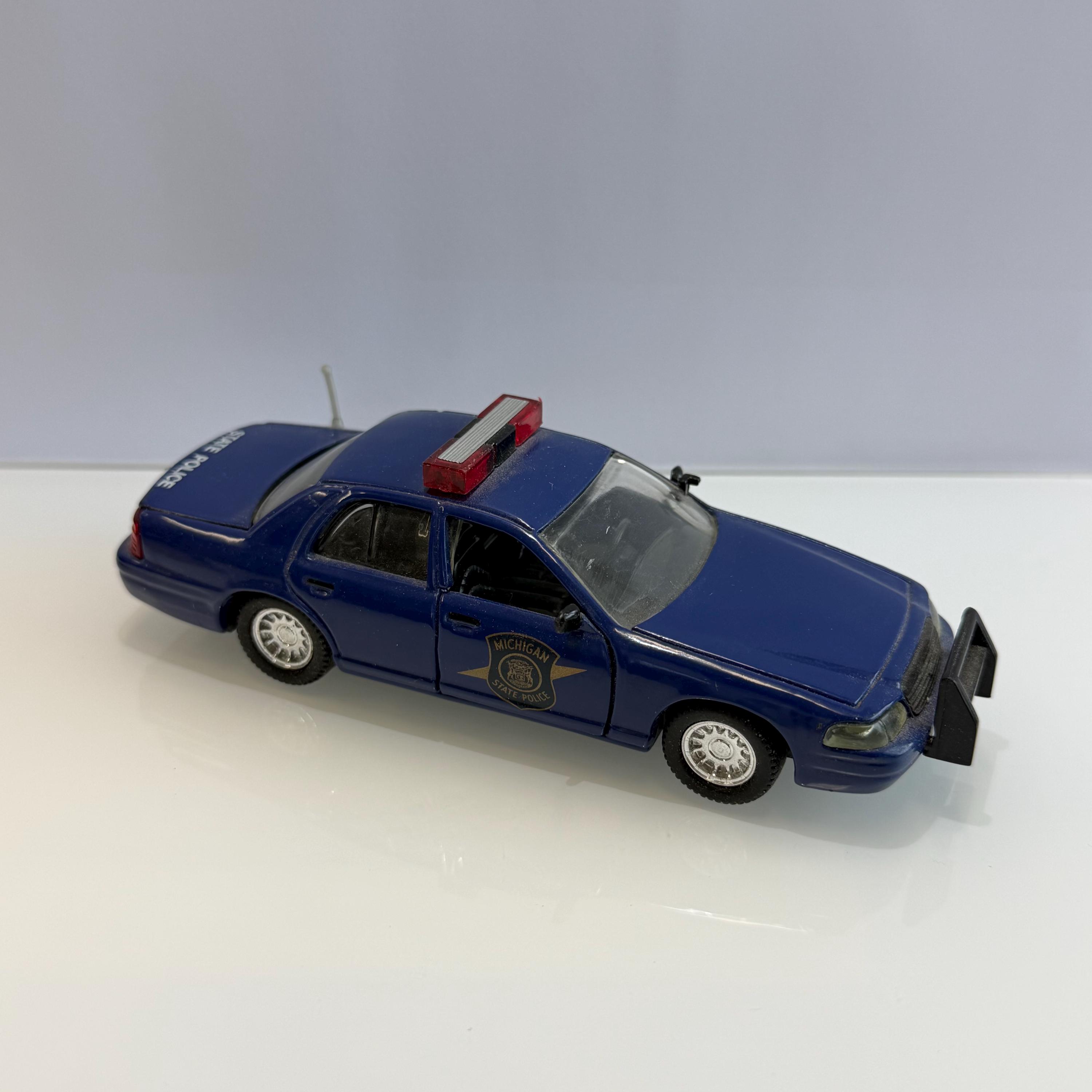 Roadchamps 1:43 Diecast Police Cruiser and Agency Police Patch