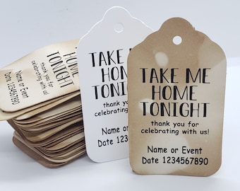 May include: A stack of brown kraft paper gift tags with the text "Take Me Home Tonight" printed in black. The tags have a hole punched at the top for string or ribbon.