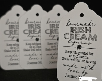 May include: Four white rectangular gift tags with rounded tops and a hole for string. The text reads: homemade IRISH CREAM liqueur, Keep refrigerated for up to 2 months, Shake well before serving, made with love by Joanne M.