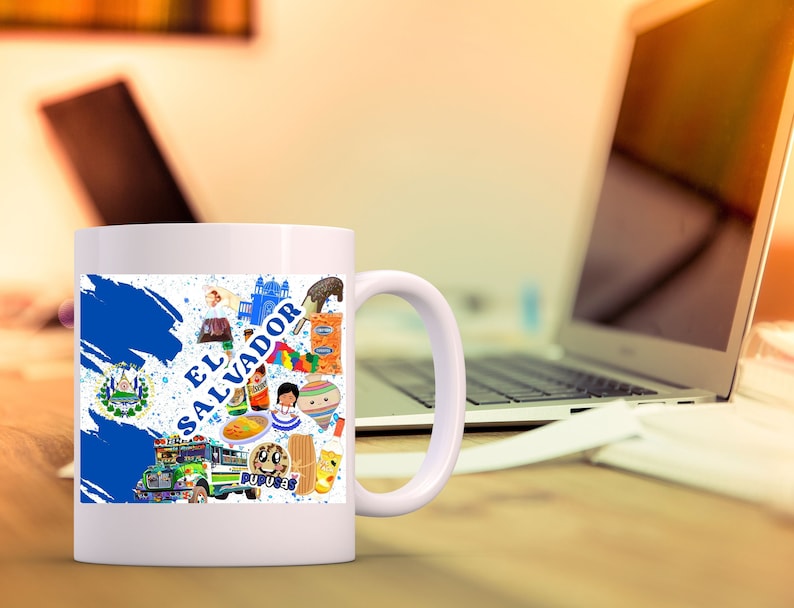 May include: White ceramic mug with a blue and white design featuring the flag of El Salvador and various cultural icons. The mug has a handle on the right side.