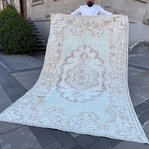 Antique Oushak Turkish Rug: 5.4x8.8 ft, Handwoven Pastel Area Rug