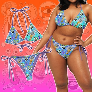 May include: A blue bikini set with a cartoon monster print. The triangle top and the bottoms have purple ties. The bikini features a repeating pattern of cartoon monsters, beverages, and other graphics on a blue background.