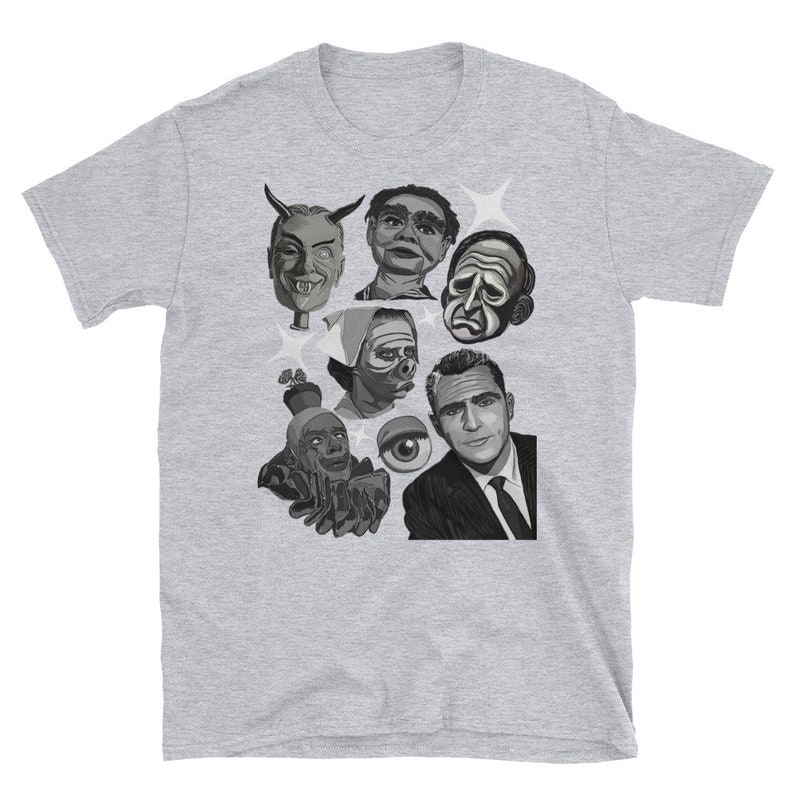 May include: A light gray t-shirt featuring a collage of black and white illustrations of various faces and figures. The graphic includes a devilish face, a ventriloquist dummy, and a man in a suit. The shirt is made of a soft material.