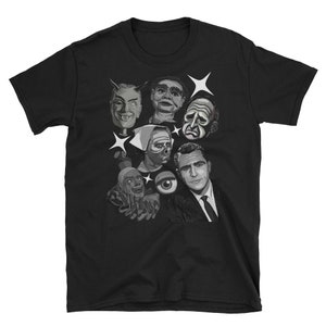 May include: Black t-shirt featuring a grayscale graphic of various vintage horror and sci-fi characters, including a devil, a ventriloquist dummy, and a man in a suit. White starbursts accent the design. A unique tee for fans of classic monster movies.